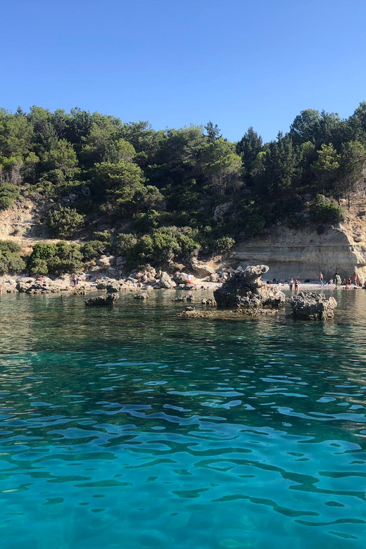 From Faliraki: Rhodes Sunset Cruise with Swimming - The Swim Stop: Masks, Vests, and Crystal-Clear Water