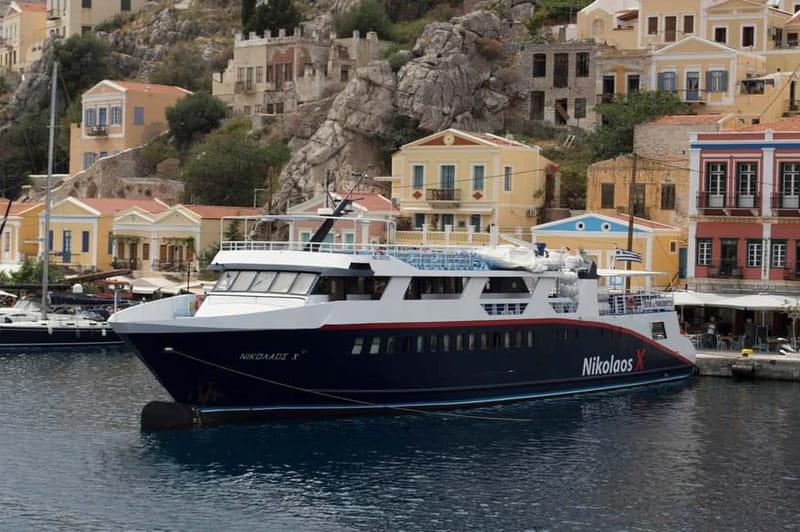 From Rhodes: Symi Island and Panormitis Monastery Day Trip - The Panormitis port view: neoclassical boats, sponge culture, and quick orientation