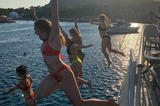 Rhodes Bay to Bay Swim Cruise-Greek Buffet w/wine included - Afandou Beach: Long Pebbly Shore, Caves to Explore, and the Lunch Switch