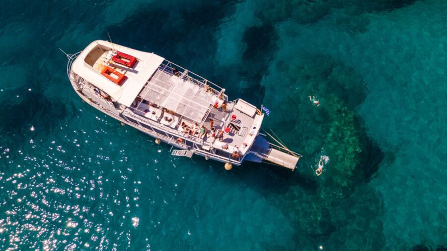 Rhodes: Bay to Bay Swim Cruise with Greek Buffet and Wine - Greek buffet and unlimited wine: how the onboard meal really works