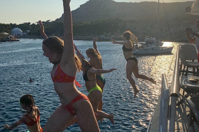Rhodes Sunset Cruise - Swim and Dine w/ Live Music & Sunset! - From Mandraki Port to the illuminated old walls