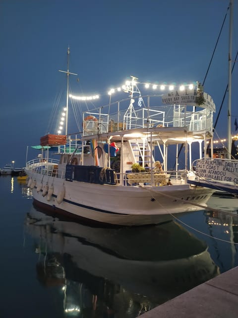 Rhodes: Sunset Cruise to Kallithea with Drinks and Snacks - The wooden boat setup: decks, bar, and real-life comfort