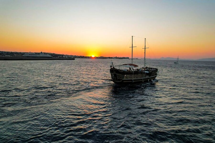 Rhodes: Sunset Cruise with Greek BBQ and Unlimited Drinks - Kalithea Springs Swim Stop: warm water, jump-in fun, and a practical heads-up