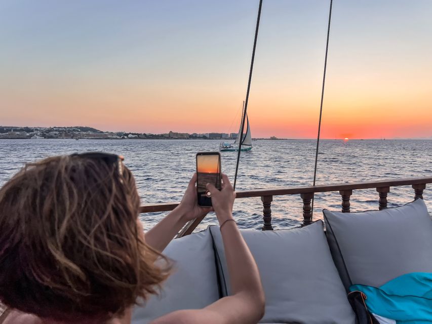 Rhodes: Sunset Cruise with Greek BBQ and Unlimited Drinks - Rhodes Town Sunset: where the magic happens (and where to sit)