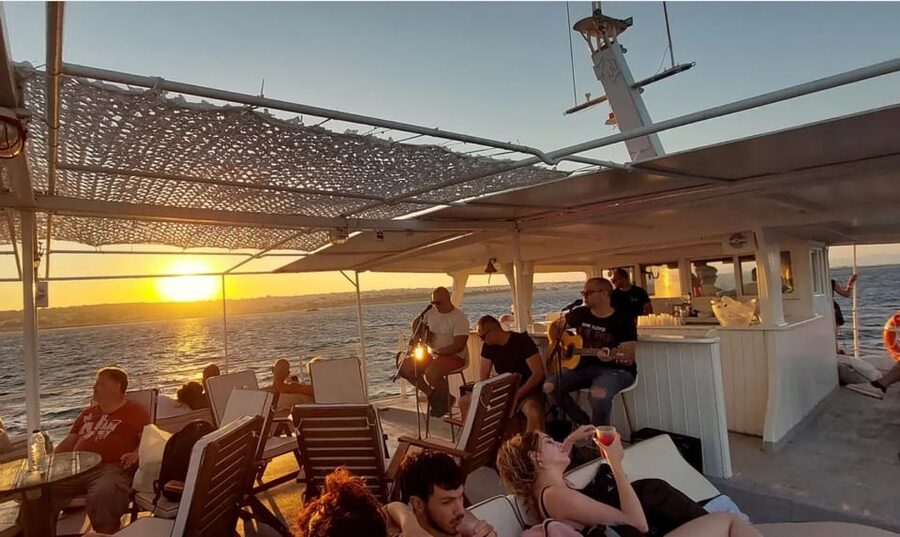 Rhodes: Sunset Cruise with Live Music, Wine & Greek Buffet - Finding Mandraki Port and Settling on Romantika Dreams