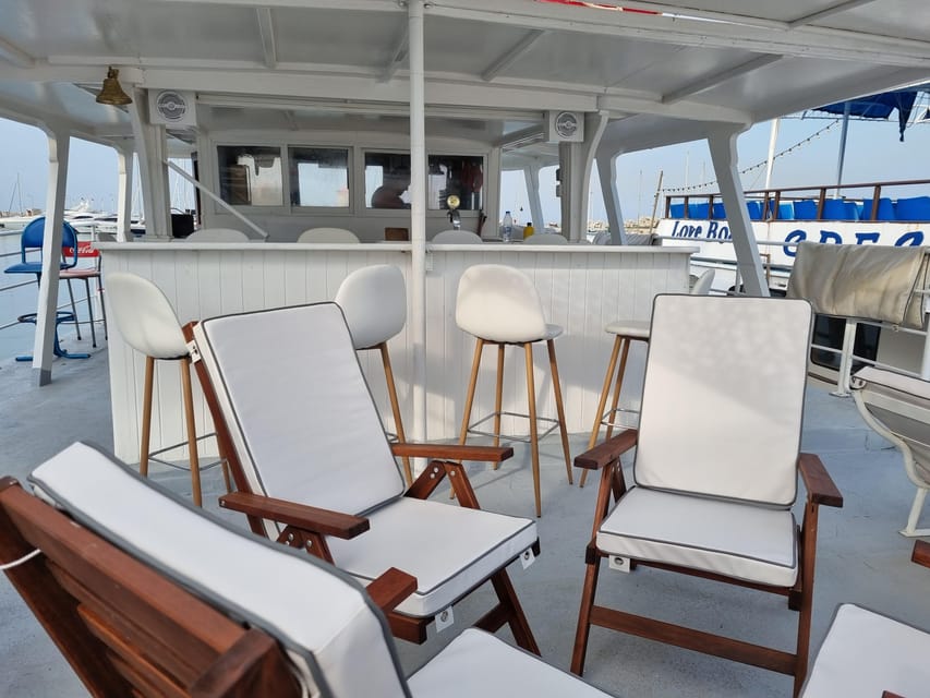 Rhodes: Sunset Cruise with Live Music, Wine & Greek Buffet - Kalithea Springs Swim Stop: Anchored Bay Time and Snorkel Gear