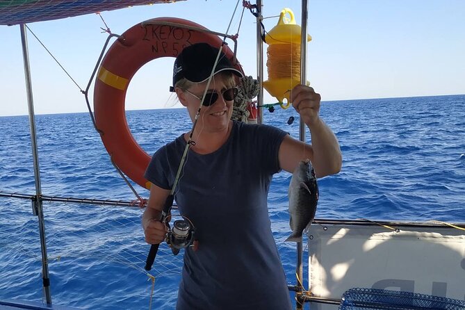 Skevos Fishing Trip Rhodes - The onboard BBQ lunch: grilled fish, Greek salad, and sea-salt goodness