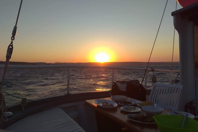 Sunset Cruise with a Swimming Stop at Kalithea Bay - Music at sunset: finding your spot when the guitars start